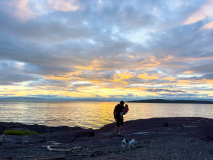 Father and child at sunset, Kamouraska, Quebec, Canada.