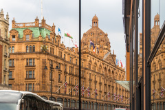 Building reflected in a store window, London, England, UK
